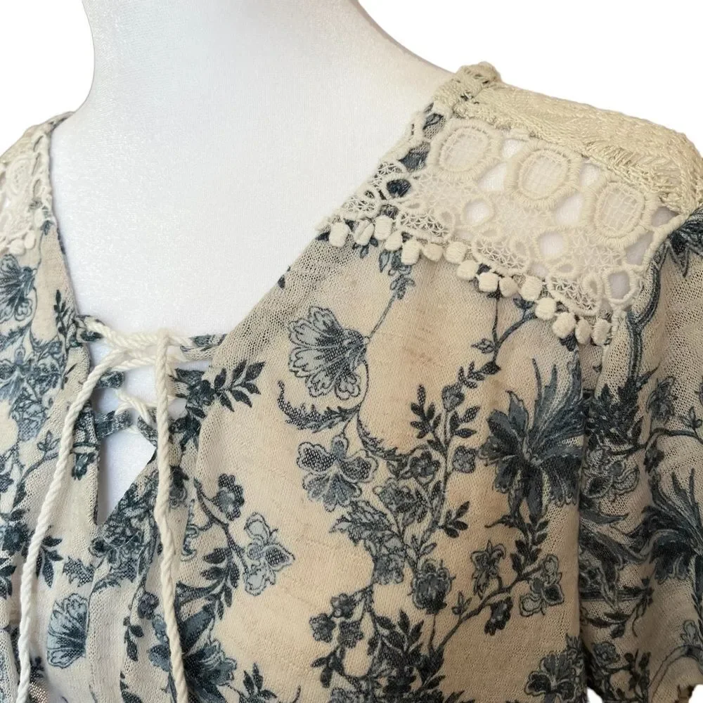 Flowy knit top with lace shoulder accent